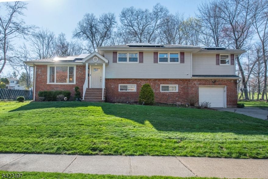 Welcome to this beautifully maintained split-level home, ideally located on a quiet cul-de-sac in one of Wayne's most desirable neighborhoods, overlooking the scenic Preakness Hills Country Club!  From the moment you step inside, you'll be drawn to the sun-drenched sunroom an inviting space filled with natural light and overlooking a private, expansive backyard. It's the perfect setting for morning coffee or unwinding at the end of the day.  The upper level features four generously sized bedrooms and two full baths, offering comfort, flexibility, and space to grow.  The primary bedroom offers separate his-and-hers closets.  Downstairs, the home truly shines as an entertainer's dream complete with a spacious family room, built-in wet bar, cozy fireplace, and a full bath, making it ideal for hosting gatherings year-round.  Set on an impressive .42-acre lot, the outdoor space offers endless possibilities from relaxing on the deck to creating your own backyard oasis.  Additional highlights include gleaming floors, custom window treatments, abundant closet space, and a walk-in cedar closet for optimal organization.  Tucked away yet conveniently located near major highways, shopping, and transportation, this home offers the perfect blend of privacy and accessibility.