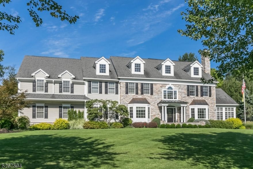 Nestled on a cul-de-sac in the heart of Basking Ridge, this exquisite colonial boasts 6 beds, 5 baths, & 2 half baths with ideal layout for modern living. A private outdoor oasis features a heated saltwater pool/waterfall, built-in gas grill and fire pit, paver patios w/awnings, hot tub gazebo, play yard and meticulous landscaping throughout. A two-story entry foyer makes for a grand entrance, revealing a handsome staircase with fine architectural details. The formal DR includes a butler's pantry w/wine cooler, while the LR warms winter evenings with a gas fireplace. An expansive kitchen boasts two granite islands, high-end appliances, a window-lined breakfast room, and opens to a family room w/fieldstone gas fireplace. Completing the first level is a sunroom with stone accented walls/floors, a 4-station office/homework room, 2 powder rooms, laundry/mud room, & pantry. Upstairs, the spacious primary suite offers 2 walk-in closets and a luxurious bath with oversized jetted tub, roomy glass shower, dual vanities and a towel warmer. This level has five add'l bedrooms, three full baths and a full laundry room. The home also provides abundant closets, an expansive walk-up attic, and a newly renovated bsmnt with a large rec room, wet bar, game room, well-appointed wine cellar and a full bathroom. Add'l amenities: 3-car garage with EV charger, owned solar panels, and whole house generator for added peace of mind. Blocks from Pleasant Valley Park, schools, shopping and train.