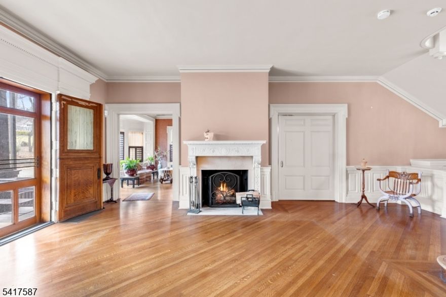 A rare, irreplaceable canvas in a prime location with architectural bones you cannot recreate today. Welcome to 90 Gregory Ave a grand 1873 estate set on a prominent corner lot in one of West Orange's most coveted and picturesque enclaves. With over 5 bedrooms, 5 bathrooms this one-of-a-kind residence presents a remarkable opportunity to restore, reimagine, and create a legacy home tailored to your vision. Home features include: Original hardwood floors, intricate moldings, stunning pocket doors that speak to an era of timeless design with 7+ fireplaces throughout. A grand foyer welcomes you with double entry doors, a statement fireplace, and sweeping staircases that set the tone for the home's scale and sophistication. Formal dining room complete with a butler's pantry, wet bar & dramatic floor-to-ceiling windows. Chefs kitchen is appointed with Sub-Zero refrigerator and Viking appliances, offering a strong foundation for a modern culinary experience. Solarium, adorned with hand-painted ceiling & lattice panels with glass-lined walls. Outdoors, the estate unfolds with a circular paver block driveway centered around a statement fountain. The backyard offers a tranquil koi pond & expansive deck space ideal for entertaining or quiet relaxation. Bring your vision. Restore its grandeur. Make it unforgettable. Just approximately 16 miles away from the energy of NYC offering a seamless blend of suburban privacy and metropolitan accessibility.