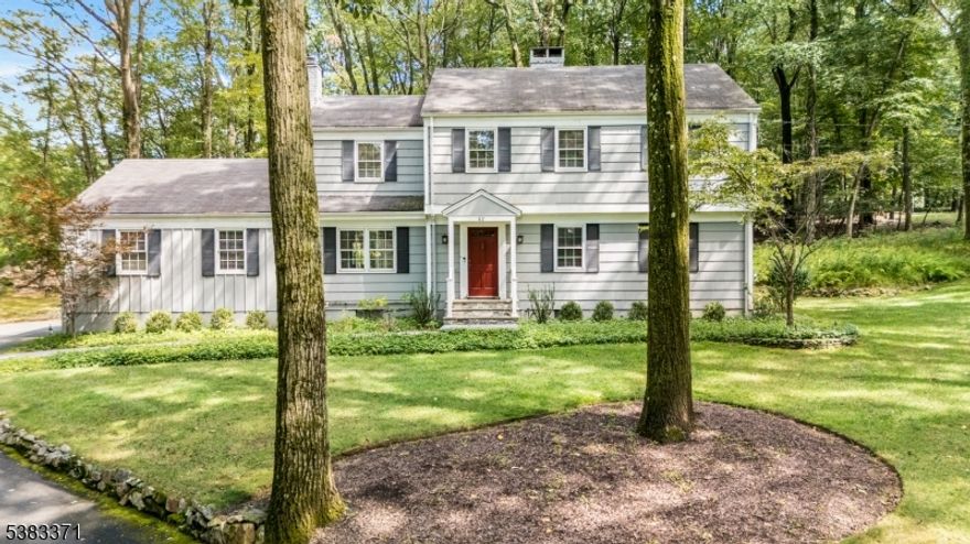 Picture perfect colonial in desirable Powder Mill Estates. This private 4 bedroom, 2 1/2 bath colonial with finished basement offers all the updates in a beautiful setting. The main level offers a sun-filled formal living room with wood-burning fireplace and inviting family room with gas fireplace with adjoining powder room. The dining room opens to the updated kitchen with exposed brick, stainless appliances, granite countertops, floor-to-ceiling cabinets and eat-in space with built-in seating at the bay window. Upstairs is a spacious primary with ensuite bathroom, 3 additonal bedrooms, all with custom closets and another updated bathroom. The fully updated basement offers tons of additional recreational space. There is a large media area with bar, sauna, as well as a seperate space for a gym, playroom or home office. There is an oversized laundry area that offers great storage space. The home sits on an idealic 1.1 acre lot and offers a newer paver patio and walkways, a flat, professionally-landscaped yard with sprinkler system, surrounded by woods that privides tons of privacy. It has an attached two-car garage, lots of additional parking and generator hook-up. Come check out this classic home in a serene setting and exceptional location in the Parsipanny- Troy Hills school disctrict, close to schools and major commuter pathways.