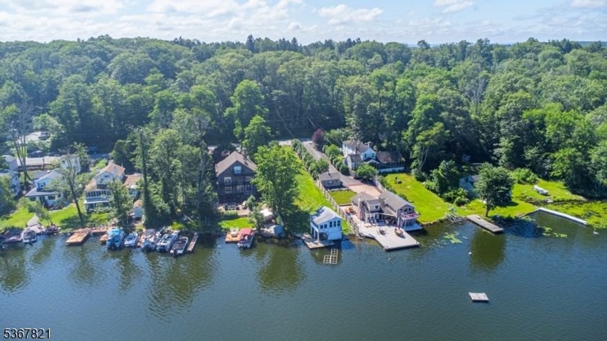 Incredible opportunity to BUILD your DREAM HOME on the East Shore of Culver Lake! These two prime parcels are ideally situated in a sought-after no-wake zone on the south end of the lake, renowned for its calm, deep waters and breathtaking sunset views. All Township and County approvals and variances are in place to build a 2 story 3 bedroom custom home with a walkout basement directly to the lake. The home is designed with 2 full baths and 2 half baths with a large first floor covered porch overlooking the lake. The design includes an 85 foot long driveway to a 2 car front entry garage. Included are the County Septic and Well approvals for installation across the street on Lot #31. All engineering has been approved and architectural plans are available. Do you want to enjoy the lake now? This lakefront lot, at #30, currently has a large concrete dock and bulkhead. The current two-level boathouse can remain during construction but must be removed after the new house is completed which will increase the views from your new home. Soak in vibrant sunsets from the dock and don't miss your chance to build the ultimate lakefront escape on one of Culver Lake's most desirable shorelines!