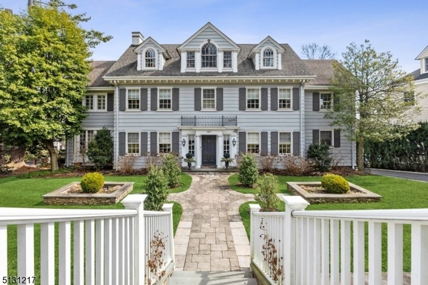 Impeccable CH Col located on prestigious Up Mountain Ave offers year-round skyline views. Home boasts lovely blend of period details & contemporary finishes. With 5 beds/5.5 baths & a fantastic location near shopping, restaurants, this gem is move-in ready & waiting for you. A welcoming foyer invites you in, where you'll find gleaming hardwood flrs, soaring ceilings, deep crown molding & beamed ceilings. A sprawling living room features a marble wb fireplace with double set of French doors leading to sunrm with charming Juliet balcony. Elegant formal dining has custom built-ins & leads to chef inspired kitchen with high-end custom cabinetry, SubZero fridge, Viking range, quartzite ctrs & lg breakfast area. Also there is a cozy sitting area w gas fire place. 2nd level offers extraordinary primary suite including sitting rm w custom built-ins including mini fridge, huge WIC & lux bath featuring heated flr, jetted tub, dual vanities & over size shower. 2 add'l en-suite BRs round out this floor. Huge retreat on 3rd level w 2 big BRs, full bath & common area perfect for media or work. Finished walk-out basement has media rm w kitchenette, bar, full bath, exercise rm, wine rm, mudrm, laundry & storage. Prof. landscaped property offers several spaces for peaceful outdoor entertaining including a deck with retractable awning & LL bluestone patio. Enjoy the English garden as well as fruit trees, pergola w climbing wisteria & floral gardens all supported by an underground sprinkler.