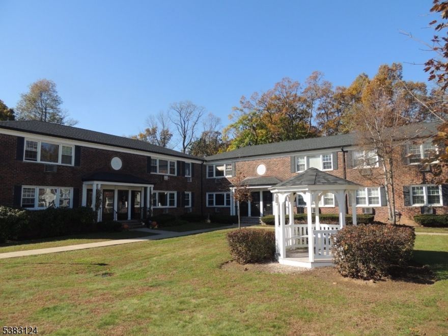 ONE-FLOOR LIVING in a prime Morristown location!!   This spacious first floor light, and bright, two-bedroom condo features large living room, eat in kitchen with white cabinets, primary bedroom with walk-in closet, second bedroom, and updated bathroom.  Enjoy the convenience of an in unit stackable washer and dryer along with generous closet space for your storage needs. Step out the back door to enjoy grassy area perfect for relaxing.  It comes with one assigned parking space; additional parking spots are available.   This well-maintained complex features a beautifully landscaped courtyard with gazebo, large association outdoor pool, sidewalks, convenient location in proximity to downtown Morristown, train station, hospital, and highways. Pets are welcomed!. Condo is currently rented for $2,625 and tenants would love to stay. Pictures are from old listing.   Come and see!!