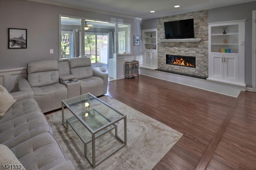 A distinctive custom townhome in sought-after Society Hill, this residence showcases thoughtful upgrades and refined finishes throughout. A striking stone fireplace with built-in bookcases anchors the living space, while detailed millwork enhances both levels. The eat-in kitchen offers a built-in window seat, breakfast bar, pantry closet, plantation shutters, and well-crafted cabinetry, creating a comfortable and functional setting.Spacious dining and living areas extend to a bright sunroom with two sliding doors opening to a private patio. The second level features a generously sized primary bedroom with millwork, window seat, plantation shutters, and two double closets, along with an updated en-suite bath. A second bedroom includes its own en-suite bath with a jacuzzi tub, oversized walk-in closet, and plantation shutters. Laundry is conveniently located on the upper level. Well maintained and move-in ready, this home offers a combination of quality finishes and practical layout. Note this lovely townhome is one of the larger units in Society Hill- 1780 sqft as per the tax records.