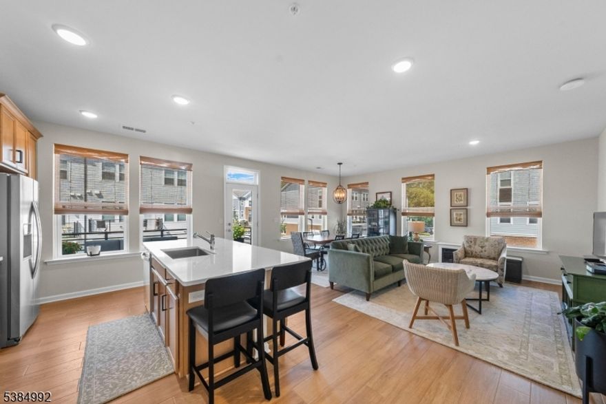 Welcome to your dream home! Nestled in a prime location just 30 minutes  New York City, this stunning 3 bedroom, 2.5 bath end-unit townhome, built in 2022, offers an EV charging outlet for your convenience. Features the largest floor plan in the community. As you enter the main level, you'll be greeted by a bright and open floor plan that seamlessly connects the living and dining areas, perfect for entertaining or relaxing. The kitchen is a chef's paradise, featuring an oversized island, sleek quartz countertops, and top-of-the-line stainless steel appliances that make cooking a delight. Each of the spacious bedrooms offers plenty of room for relaxation and comes with generous walk-in closets, ensuring you have all the storage space you need. The 2.5 bathrooms are elegantly designed, providing comfort and style. But the wonders don't stop at your doorstep! Step outside and discover luxurious amenities that enhance your lifestyle. Whether you enjoy a friendly match on the tennis court, a refreshing dip in the pool, or a vigorous workout at the gym, there's something for everyone. And don't miss the rooftop entertaining area, a perfect spot for gatherings or enjoying serene evenings under the stars.With local shops and restaurants just a stone's throw away, you'll have everything you need right at your fingertips. This end-unit townhome is not just a place to live; it's a lifestyle to embrace. Schedule your visit today and experience luxury living at its finest!