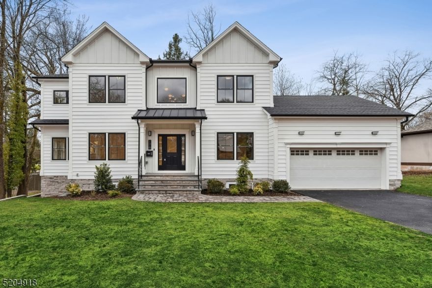 Spectacular 6 bedroom, 4.5 bath and over 4,700 sq. ft. custom-built home situated on one of South Orange's most stunning streets in the historic Montrose Park district. Located just steps from Grove Park and .5 miles to vibrant downtown South Orange and NYC trains, this turnkey home is a masterful blend of contemporary updates and custom finishes with the classic lines of a timeless colonial. A light-filled, double height entry foyer opens to a spacious living room and formal dining room. The gourmet chef's kitchen will excite even the most seasoned cooks: high-end Bosch appliances, quartz counters, farmhouse sink and a center island adjoin a spacious family room (one of two) with gas fireplace and backyard access through sliding doors. A butler's pantry with sink and wine fridge, mudroom and powder room complete this level. Walk up to four spacious bedrooms and three full baths. The luxurious primary suite includes a spacious walk-in closet and sumptuous bath with double sinks, separate shower and soaking tub. The lower level adds an entire floor of living space with 9' ceilings, two additional bedrooms, office, full bath and family room with custom wood wall. Second walk-out to patio and spacious backyard. The perfect home for large gatherings and impromptu or formal entertaining both inside and out. This is a unique opportunity to live in a custom built, maintenance-free home in historic Montrose Park, just 30 minutes from NYC.