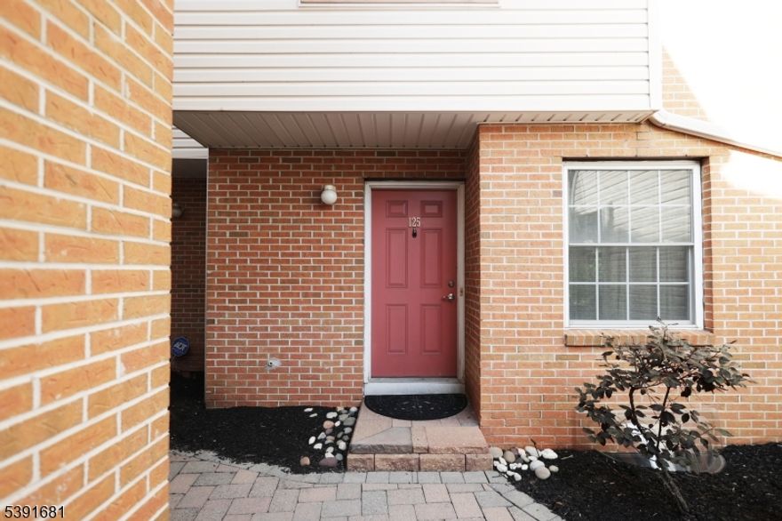 Welcome to this beautifully maintained 3-level townhome offering comfort, convenience, and commuter-friendly living. Enjoy two covered parking spaces with direct entry to a spacious unfinished storage area on the ground level. The main floor features a modern kitchen with granite countertops, a convenient half bath, and an open-concept living/dining area accented with elegant molding and gleaming hardwood floors. Step out onto your private balcony just off the living room perfect for relaxing or entertaining. Upstairs, you'll find two generously sized bedrooms, each with its own full bathroom, plus a laundry closet for added convenience. Located just steps from the NJ Transit train station with direct service to NYC, North Jersey, and the Jersey Shore! You'll also be close to a beautiful county park, and everything South Amboy has to offer including the YMCA, major highways, and ferry service to Lower Manhattan. Don't miss this opportunity to live in one of South Amboy's most desirable communities