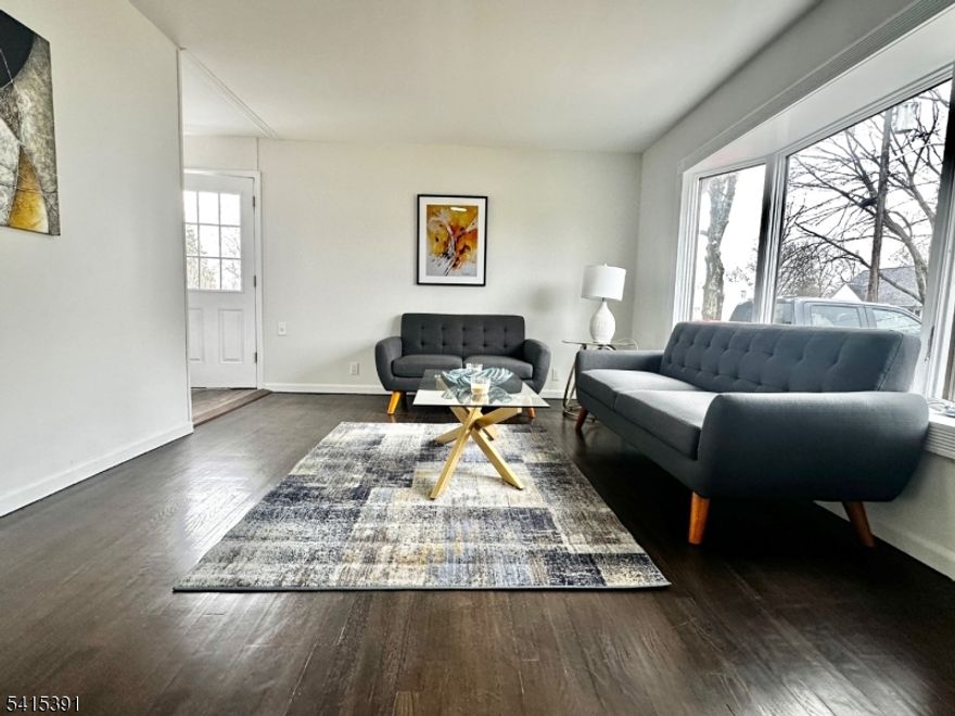 Welcome to this move-in ready 4-bedroom, 1.5-bath home offering comfort, flexibility, and convenience. The home features newly finished flooring, an updated main bathroom with a new vanity, toilet, and modern fixtures, as well as brand-new stainless steel kitchen appliances. Fresh paint, new doors, and contemporary ceiling fixtures throughout create a bright, clean, and inviting interior.Upstairs, the bedrooms offer versatile living options. Use them as two separate rooms or combine the space to create a spacious primary suite with a cozy sitting area or home office.The basement provides plenty of additional space with multiple rooms ideal for storage, a home office, gym, or hobby space perfect for adapting to your lifestyle needs.Outside, you'll find multiple sheds that provide ample additional storage for tools, equipment, or seasonal items.Ideally located near major highways, shopping areas, and public transportation, this home offers both convenience and accessibility. For added peace of mind, a 1-year home warranty is included.