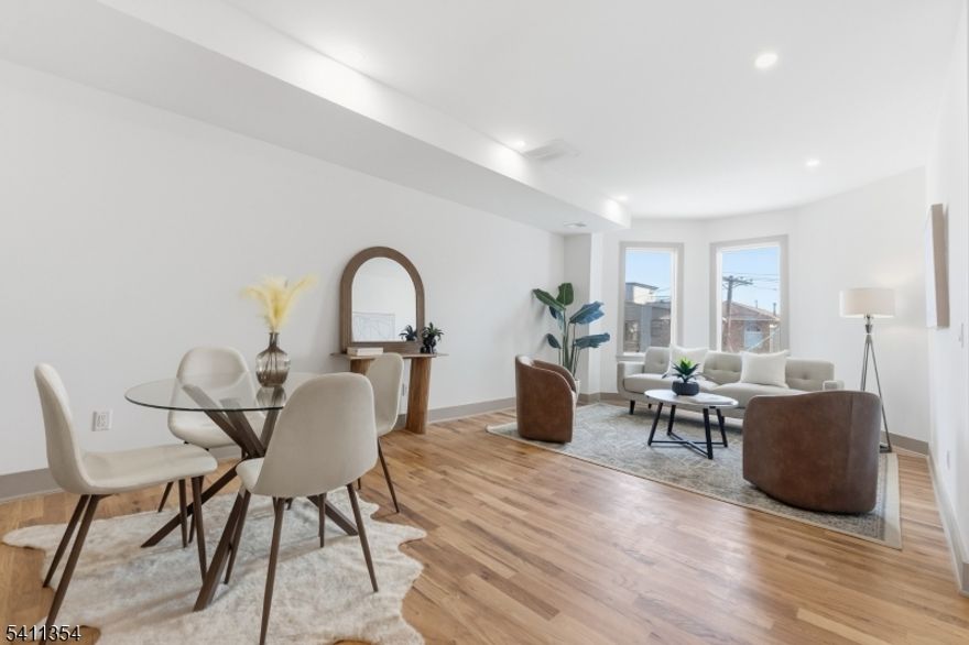 Welcome to this truly exceptional, custom-built two-family residence, with both units offering approximately 2,000 sq ft duplex( 2 floor) layouts. Each home features a seamless open floor plan filled with abundant natural light, thoughtfully designed for modern living and flexibility; Oversized window to show case the NYC Skyline.The property offers a total of 8 generously sized bedrooms and 6 full designer bathrooms, blending scale, comfort, and functionality ideal for owner-occupants, flex living, or investors. The garden level provides private front and rear walk-out access, and each unit including the basement has its own dedicated entrance, enhancing privacy and versatility.Situated on a fantastic street with NYC views, this home is just minutes from the Light Rail and moments from Berry Lane Park.Every detail has been carefully curated, from the intelligent floor plan to the oversized windows that flood the home with sunlight. Located in one of the area's most desirable and rapidly growing neighborhoods, this is a rare opportunity to own a custom, turn-key two-family property offering exceptional scale, versatility, and location truly unmatched in today's market.