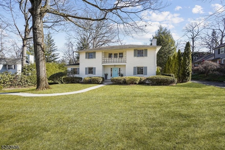 Brick Faced Colonial in coveted Woodland Park.  5 bedrooms, 4.1 baths and open concept kitchen and family room that steps right out to beautiful private level rear yard and patio.  Newly painted exterior and interior, refinished hardwood floors, extensive professional landscaping.  2 car attached garage.  5th bedroom on first floor for guest room or home office.  Spacious rooms and versatile floor plan.  Franklin Elementary school. Location, location!