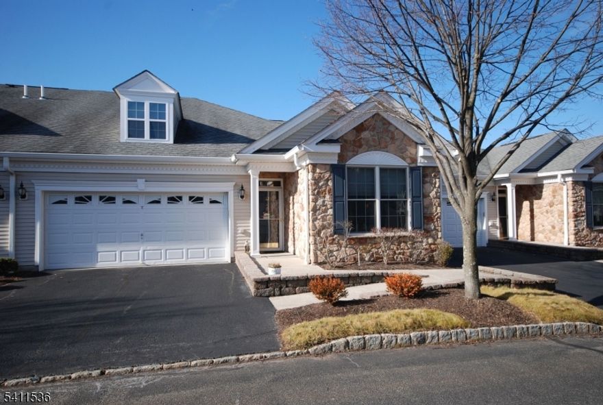 HIGHLY Desired GRENACHE Villa Style Home in a 55+ PREMIER GATED COMMUNITY!    Everything is on one level offering an ideal layout of rooms with fantastic finishes throughout.   Custom kitchen with light cabinetry, granite countertops, center island & 5-burner stove.  Primary bedroom suite has a large sitting area (easily convertible to a separate den), double-sized walk-in closet (quality shelving/drawer solid wood organizers), luxurious bathroom & 2nd deck.  Featuring upscale lighting, amazing ceilings, hardwood floors (also under DR/LR carpet), plantation shutters & new hot water heater/AC condenser.   Relax & enjoy outdoor space on the deck with sunset views.   Convenient access through a private two-car garage plus two spots in driveway.  Resort style living with a 25,000 sq. ft. clubhouse and BEST amenities: indoor/outdoor pool, tennis/pickleball, putting/driving, fitness center, card rooms/Mahjong, ballroom, activities & clubs. Bordering Upper Montclair with great restaurants, theaters, shops, boutiques.   Short distance to NYC Bus & train station. Truly, a wonderful lifestyle!