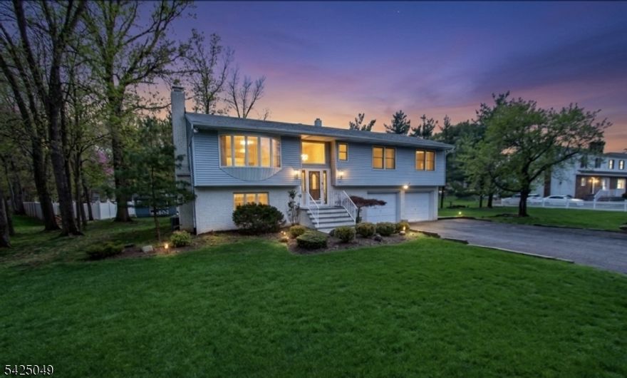 Offered for the first time, this meticulously maintained 3-bedroom, 2.5-bath bi-level home sits on over a serene half-acre lot, delivering the perfect blend of space, comfort, and opportunity. Pride of ownership is evident throughout, with generously sized bedrooms, including a primary bedroom with walk in closet  and a well-designed layout ideal for both everyday living and entertaining.The main level features bright, inviting living spaces with access to a spacious covered  deck overlooking the peaceful backyard perfect for morning coffee or evening relaxation. The lower level offers a versatile layout complete with a summer kitchen, opening to a beautifully finished paver patio, making it ideal for extended living or entertaining guests.With a possible mother-daughter setup and subdivision potential, this property presents exceptional flexibility for a variety of lifestyles or future investment opportunities.Enjoy the convenience of being within walking distance to the scenic trails and natural beauty of Rifle Camp Park and Garret Mountain Reservation, offering year-round outdoor recreation just moments from your doorstep.A rare opportunity to own a lovingly cared-for home in a tranquil setting with endless potential.