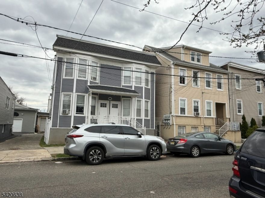 A well maintained property consisting of a 4 family plus 2 family and a 5 car garage......near public transportation, major highways and shopping ,a must see!!!!!!!!!!!!!!!!!!!!!!!!!!