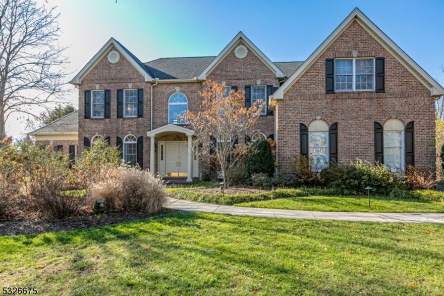 Spectacular landscaping and new hardscaping surround this spectacular Bedens Brook Estates Colonial with an oversized heated inground swimming pool. The beautiful, sun-filled interior with a true designer feel is sure to impress even the choosiest of homebuyers. Up front are the formal spaces lying to the side of a graceful entrance hall. The vaulted family room with an exquisite gas fireplace, a large conservatory, and a study are near the custom, open kitchen. The sophisticated mingling of granite surfaces, attractive cabinetry, and high-end appliances, including a Thermador cooktop with downdraft on the cooking island and a Thermador wall oven, are refined features further highlighted by loads of natural light. Two powder rooms are rare, and one was cleverly added to the mudroom near the pool, making it an ideal changing station in the summer. Upstairs, all four bedrooms connect to a bathroom. The main suite crowns this level with its fabulous dressing closet in addition to two other walk-in closets, a sitting room, and an upgraded bathroom with a Victoria Albert tub, oversized shower, heated towel rack, and more!  A three-car garage, a full, usable basement, and amenities galore are found throughout this meticulously maintained home that is set upon a cul-de-sac with no neighbors on one side!
