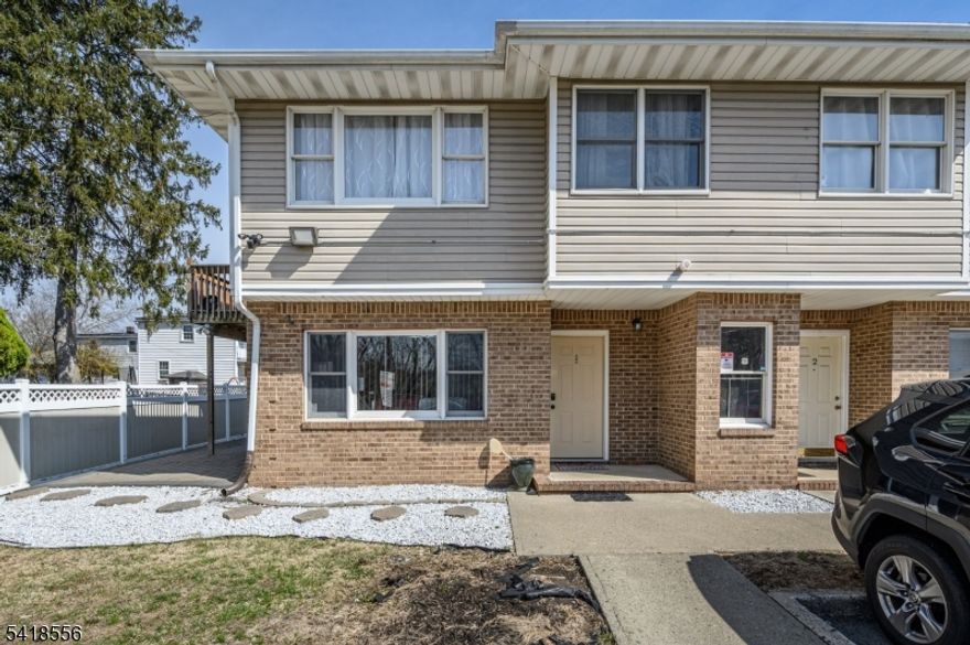 Dakota Parc premieres this lovely 2 Bed 1 Bath ground floor unit in Paterson. Meticulously maintained inside with recessed lighting, ceramic tile flooring, and a fresh palette throughout. The spacious light & bright Living/Dining combo welcomes you in to find open concept layout, ceramic tile flooring and sliding glass door that leads to the outdoor patio. The Kitchen features SS appliances, granite counters, and a pass through window to the Dining Rm for easy conversation when entertaining guests. In unit laundry is so convenient. Down the hall the modern, sleek full bath with tiled stall shower offering a built in bench and glass doors + 2 generous Bedrooms inc the Primary. Primary bedroom boasts a walk-in closet and private access to the main bath. Relax outdoors on the paver patio. 2 assigned common area parking spots included. Close to shopping, dining, parks & schools + public transportation and major roads for easy commuting. Come & see TODAY!