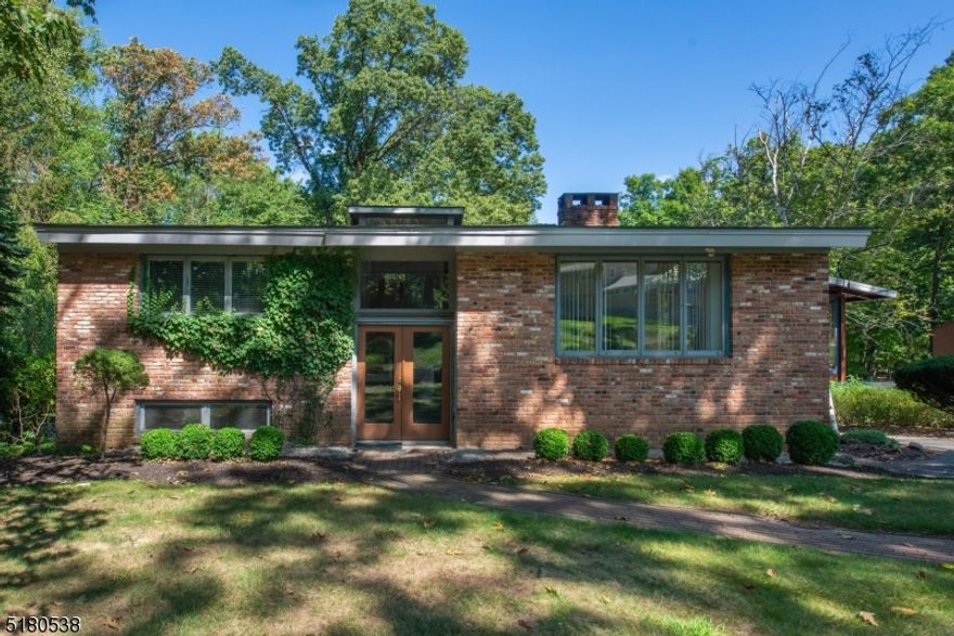 Bright & Sunny Bi-Level with a Contemporary, Mid-Century Flair!! Located on a quiet street in the desirable Glacier Hills community. Lovingly cared by the same Owners for 55 YEARS. Lots of Generous Room Sizes to Spread Out & Make Your Own! Tons of natural light -large windows throughout living space. Open LR with double sided WB fireplace, formal DR & Eat-in Kitchen. Screened-in porch. 2 generous sized BDRMs & full bath upstairs. family room, Den & Flex room on lower level. Two additional fireplaces. 3rd BDRM, half kitchen & bath/mudroom completes this floor. Enclosed porch. Plenty of storage! The backyard is level & private. Large deck. An ideal spot to relax & enjoy life. DREAM HOME potential! Minutes to all the community has to offer; with membership -enjoy the pool, walking trails, playground, events, etc. Convenient to NYC-Direct mass transit. Great Parsippany Schools.