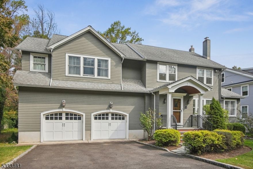 Perfectly positioned on a coveted cul-de-sac in Madison's prestigious Hill section, just moments from town, train, and top-rated schools, this stunning 5 bedroom, 3 full bath home blends timeless character with modern updates. Step inside to find sun drenched spaces designed for both everyday living and elegant entertaining. The inviting living room, anchored by a fireplace, opens to a private office and a gracious dining room, setting the stage for intimate gatherings.The heart of the home is the beautifully renovated eat-in kitchen, where a charming banquette for casual dining, expansive pantry, and mudroom provide effortless functionality. Sliding doors lead to a brand new deck, seamlessly extending the living space outdoors. The adjacent family room is warm and welcoming, creating the perfect setting for cozy nights in. A full bath, laundry room, mudroom and over sized 2 car garage complete this level.Upstairs, four bedrooms offer comfort and privacy, while the expansive primary suite is a true retreat, boasting two walk-in closets and a serene, spa-like bath with dual sinks, a soaking tub, and a  shower. The third level is a private oasis perfect as an office, playroom or fifth bedroom. Outside, the private, flat yard is a peaceful oasis, ideal for gardening, play, or simply unwinding in nature's embrace.  This home is a rare opportunity to experience the best of Madison living, where charm, convenience, and modern luxury come together in perfect harmony.