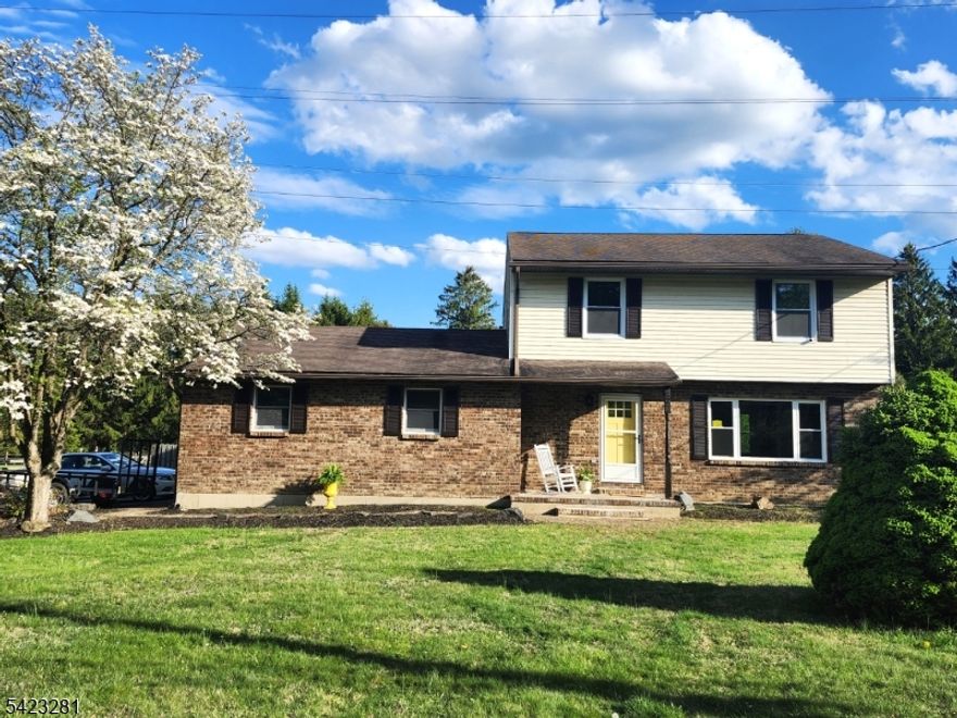 This charming renovated Colonial perfectly blends classic character with modern upgrades. Featuring 3 spacious bedrooms and 1.5 stylishly updated baths, this home is move-in ready and designed for comfortable living. The main level boasts an open, sun-filled layout with a brand-new kitchen, farm style sink, new LVP flooring through out, some new windows, a NEW HVAC unit with a heat pump, while the finished basement offers the perfect bonus space for a home office, gym, or media room. Outside, enjoy the large deck overlooking a .63 acres private yard ideal for weekend gatherings.  A 2 car oversized garage is just the right size for your cars.