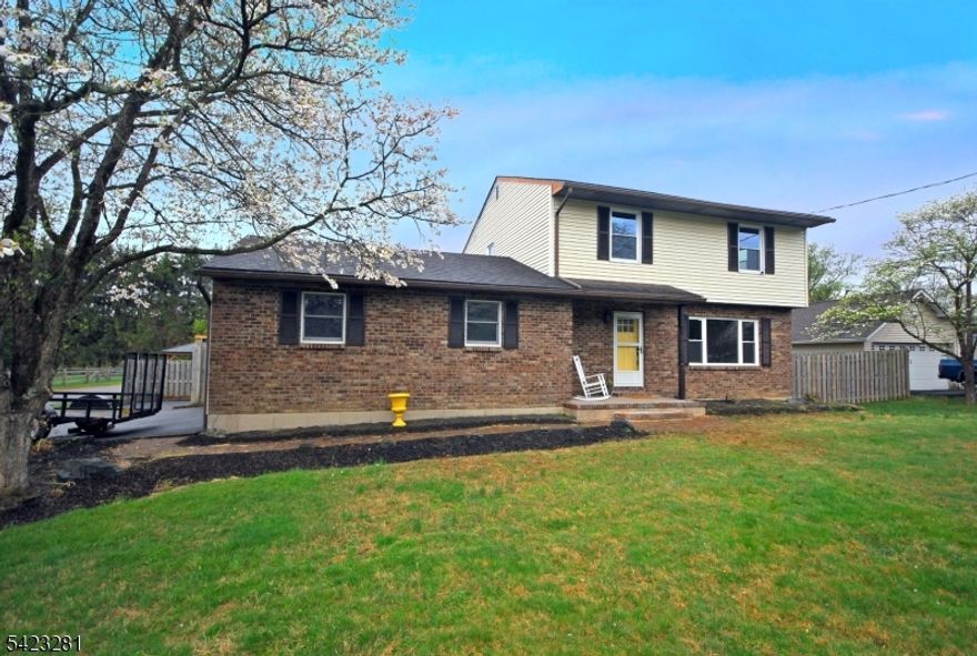 This charming renovated Colonial perfectly blends classic character with modern upgrades. Featuring 3 spacious bedrooms and 1.5 stylishly updated baths, this home is move-in ready and designed for comfortable living. The main level boasts an open, sun-filled layout with a brand-new kitchen, farm style sink, new LVP flooring through out, some new windows, a NEW HVAC unit with a heat pump, while the finished basement offers the perfect bonus space for a home office, gym, or media room. Outside, enjoy the large deck overlooking a .63 acres private yard ideal for weekend gatherings.  A 2 car oversized garage is just the right size for your cars.