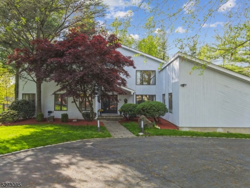 Spectacular mint condition Modern Contemporary with an open layout & soaring ceilings! Every inch has been renovated to perfection on .49 acre retreat w/ oasis-like feel w/ view of the pond from the backyard (architect confirmed room for a pool), ideally located walking distance to highly rated Farbrook School, Deerfield Elementary School (just 0.4 miles), & Old Short Hills Park & Greenwood Gardens (0.4 miles)! All new baths & stunning new gourmet chef's eat-in kitchen (2021) w/ skylights, custom cabinetry, quartz countertops, center island, top of the line SubZero & Thermador appliances, new wine cooler, new coffee station & new pantry! Circular driveway & grand 2 story family room w/ 18' high ceilings, great natural light & wood-burning fireplace, dining room w/ chandelier, stunning & unique sunroom w/ its own HVAC overlooking deck & property, living room or in-law suite, easy 1st floor access to attached 2-car garage, & laundry on 1st floor. Luxurious Primary Bedroom Suite w/ 2 WICs & new spa-like bath w/ soaking tub & shower. 4 more bedrooms share 2 more new baths on 2nd floor. Beautifully finished lower level w/ kitchenette, media room & powder room. Other improvements include newly sanded, stained & refinished HW floors , new roof, new skylights, new boiler, new landscape lighting, new Rainbird irrigation system, new deck lights, new Tesla Charging station, new garage door system, new HVAC for sunroom, new moldings & extensive painting! Low Taxes!