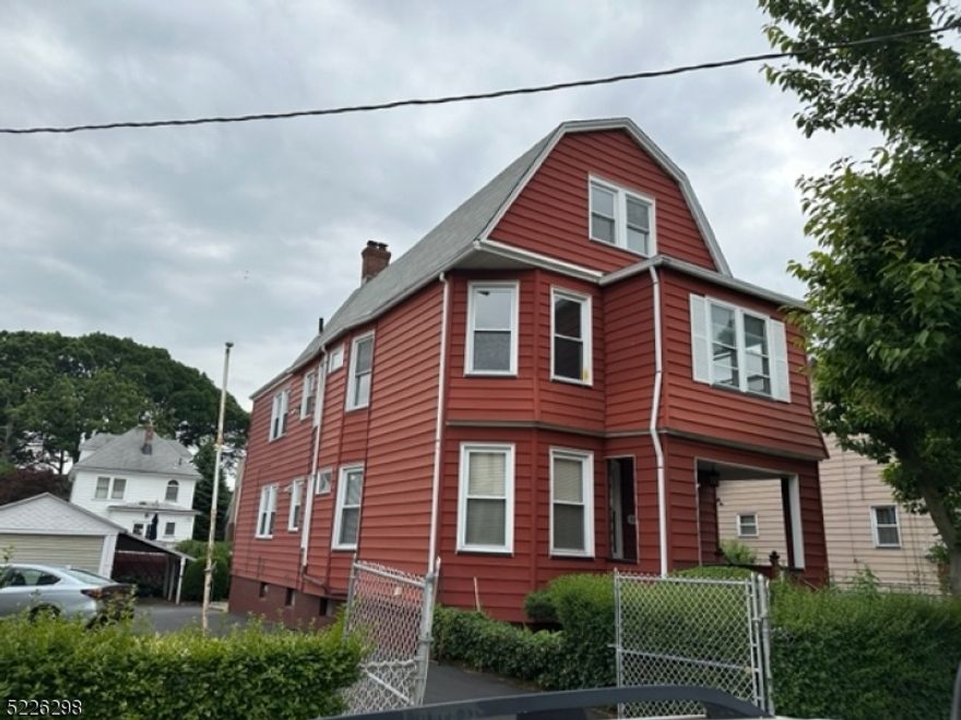 Strong income-producing opportunity in a desirable Belleville neighborhood. This spacious two-family property sits on a wide, private lot and features separate utilities, making it ideal for long-term rental ownership. The first-floor unit offers generous living and dining areas, an eat-in kitchen with pantry and laundry area, two bedrooms, and a full bath. The second unit spans two levels and includes four bedrooms, two full baths, a dedicated office, and its own living room, dining room, and eat-in kitchen also with pantry and laundry.Additional value includes a low-maintenance, maintenance-free exterior, a full unfinished basement providing ample storage or future potential, a detached two-car garage, and abundant off-street parking. The fenced yard with mature landscaping enhances tenant appeal. Convenient access to NYC bus transportation, shopping, and dining supports consistent rental demand. Property is being sold as-is, offering investors a solid opportunity for cash flow with value-add upside.