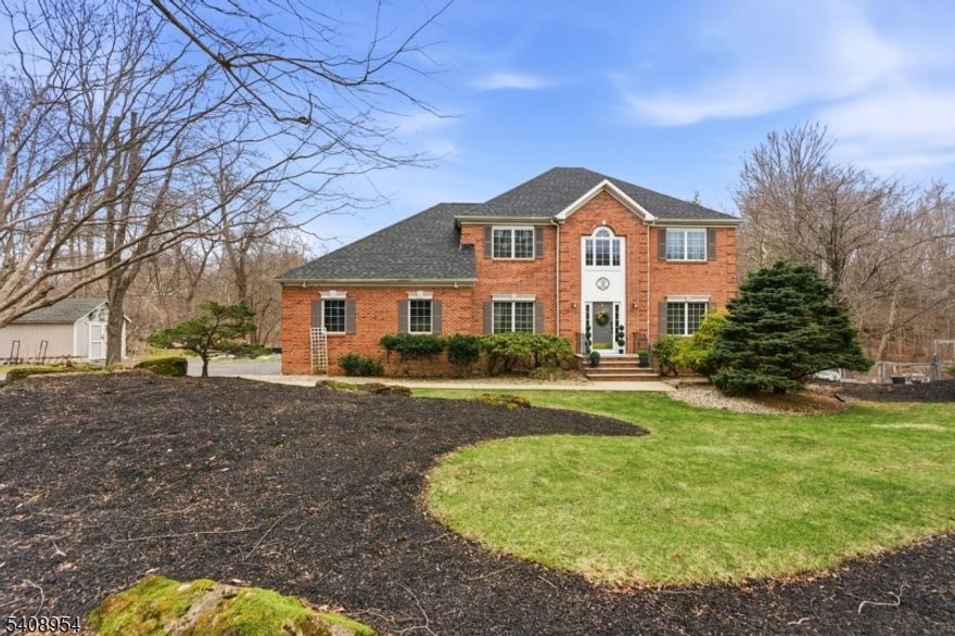 Live in the town locals consider, "NJ's best kept secret!"  Nestled on 2+ cul-de -sac acres & surrounded by woods, this pond-front home seamlessly blends comfort & elegance. Beautifully maintained and masterfully updated, you'll feel right at home from the moment you enter. Rich hardwood floors run throughout, complementing the newly updated Kitchen with expansive island. The adjacent Family Room with woodburning fireplace invites relatxation & the covered "maintenance free" deck, a Summer BBQ.  The Full Finished Walk-out Basement elevates the property's entertainment potential, complete with a Full Bath, wet bar, pellet stove, and pool table--ideal for hosting all kinds of gatherings. Head outside to your backyard oasis where the 3 yr old Sylvan 16x32 inground pool with integrated hot tub & diving board offers luxurious relaxation and summertime fun. At the end of the day, your expansive Primary Suite featuring a spa-inspired Bath and a dream walk-in closet, beckons.  All of this plus a brand new (3/2026) roof  & owned solar panels for discounted electricity! Enjoy swimming, kayaking or fishing in your backyard and the convenience of nearby highways, stores and restaurants! It just doesn't get any better than this! (Please confirm tax amount. May be incorrect on Zillow.)