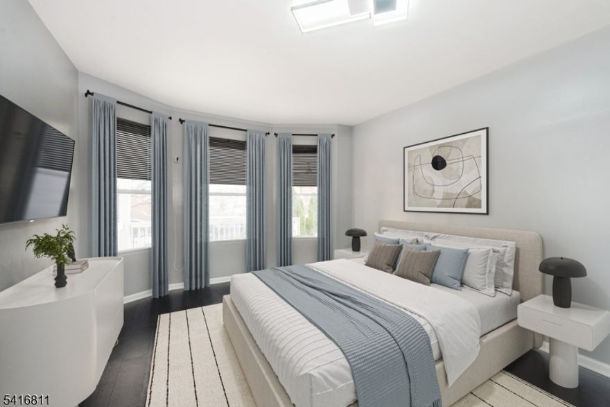 Experience the height of refined living in this meticulously renovated first-floor unit,  where modern sophistication meets effortless comfort. This open concept large four-bedroom, two-bathroom home has been reimagined with a curated matte black and gold design palette. Complemented by brand-new radiant heated-flooring & designer lighting.  The open concept kitchen and spa-like bathrooms showcase premium finishes, while the inclusion of an in-unit washer and dryer ensures seamless daily convenience. Nestled on a tranquil residential block with easy parking and superb proximity to bus and rail links, the home's crowning jewel is its private backyard sanctuary. Enclosed by a secure privacy fence and featuring a spacious deck and a charming gazebo with ambient lighting, this serene outdoor retreat provides an exclusive space for sophisticated entertaining or quiet relaxation under the stars. Tenant requirements: income and credit verification required.