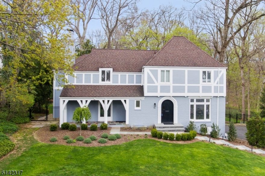 Bright, inviting, and comfortable - every once in a while you get them all! Welcome to this gorgeous, casual Tudor Colonial offering the best of everything. Spacious formal rooms offer entertaining in a modern yet cozy atmosphere.   The sunny, updated chef's kitchen boasts a large eating area, tons of cabinets and top of the line appliances- two dishwashers, two sinks overlooking the backyard. A spacious office with half bath and tons of built-ins lies conveniently beyond the family room affording a quiet and private space for concentrating - easily transformed to first floor bedroom suite.  The comfortable family room has a door to a rear facing screened porch.  Overlooking the reservation, the spacious primary suite provides respite and quiet relaxation away from the stresses of everyday. Vaulted ceilings, large closets, and an oversized Jerusalem stone bath with claw foot soaking tub deliver ambiance and luxury.  Three additional bedrooms (one ensuite) and a large hall bath complete the second level.  The third floor has a finished attic bedroom, office, or den with lots of storage. The large basement houses a two car garage with EV charging station, mud room, gym, rec room, full bath, laundry and tons of storage. Enjoy the gorgeous fully fenced backyard totally prepped and ready for a pool, with stone patio and private gate leading into the South Mountain reservation.