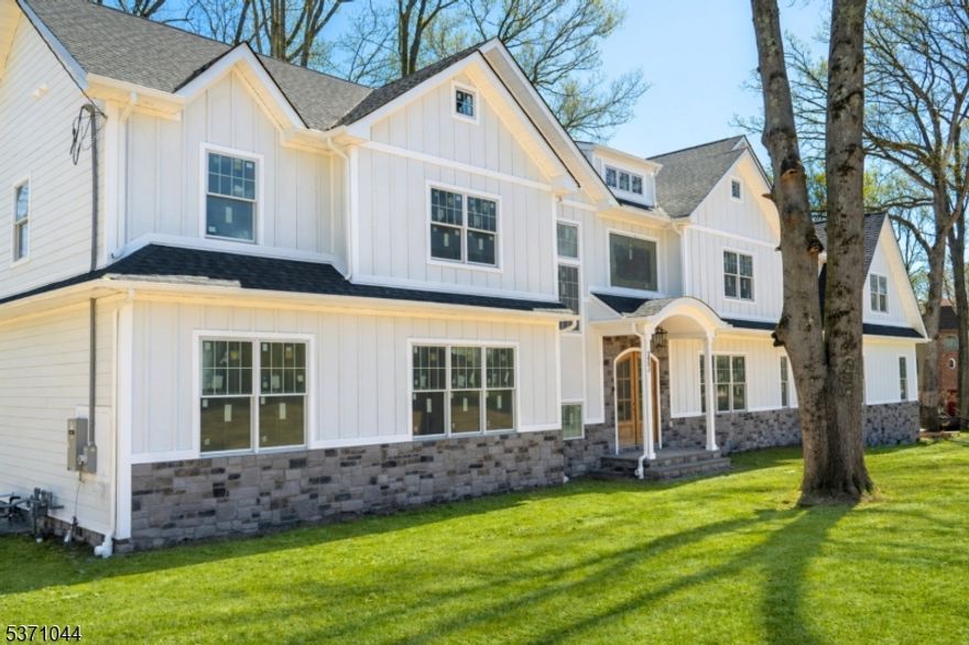Enjoy the summer on the lake!  Lakefront living in Shadow Lake Estates, distinguished residences with private, membership-only amenities. This custom colonial is a masterpiece, featuring 5 bedrooms, 5.2 bathrooms, and three levels of elegantly crafted living space all set against a breathtaking backdrop. Step through the grand two-story foyer into the first floor, where sophistication meets functionality. The formal living and dining room provide an inviting space for entertaining, while the gourmet chef's kitchen with a center island, custom cabinetry, and a walk-in pantry overlooks serene lake views. A spacious family room with a cozy fireplace, a first-floor guest suite with a private en-suite, and a powder room and mudroom complete this level. The second floor is a retreat of pure indulgence. The luxurious primary suite offers two walk-in closets, a private dressing room, and a spa-inspired bath with a soaking tub, oversized shower, and dual vanities. A private lounge area enhances this serene escape. Three additional bedrooms each feature ensuite baths and walk-in closets, ensuring privacy and comfort for all. The lower level provides even more living space, with a recreation room, media lounge, powder room, and abundant storage. Enjoy members-only access to a premier collection of private amenities, including a clubhouse, pool, boating, fishing, tennis and more.