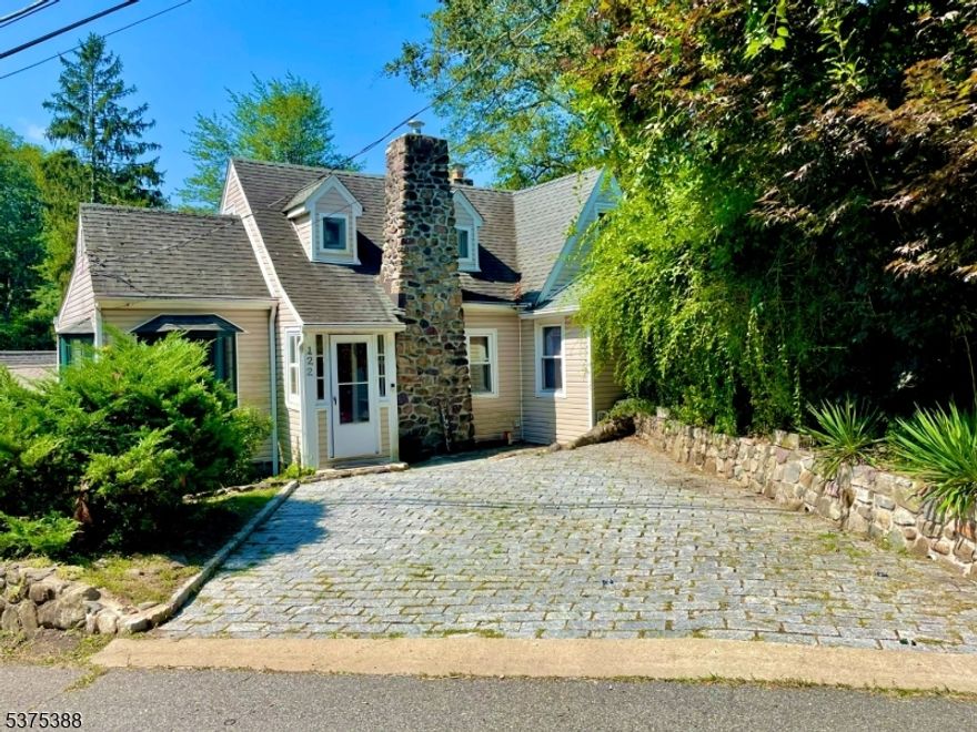 Welcome to this charming 3 bed, 2 bath house in Lake Arrowhead. Enjoy lakefront living with your own private dock space. Enter the front door to a large living room with wall to wall windows facing the lake including an extra den/office space and full bath. The large galley kitchen offers eating space in front of the large bay window and access to an expansive deck for additional outdoor living space. Upstairs features the primary bedroom with abundant closet space, secondary bedroom and main bathroom with large shower stall and skylight. The basement includes washer/dryer, large semi finished space and walkout to the backyard and lake. Conveniently located off of Rt 46 and close to downtown Denville.