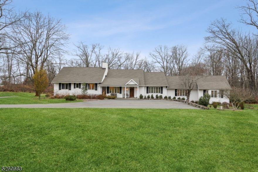 Nestled on a private lane in the heart of New Vernon, this updated 5 bedroom custom home has everything. The home is set on over 6 acres of picturesque propertyensuring privacy and tranquility. Modern features and thoughtful additions are evident throughout. Wood floors complement the large sunfilled rooms. The oversized kitchen features a vaulted ceiling, top of the line appliances, center island and a wall of windows with views of the back property.The residence is divided into two wings for added privacy. One wing includes a large primary suite with double sinks, a soaking tub, stall shower and walk in closet.This wing also houses another bedroom, laundry area and leads to a bright sunroom/ office. The opposite wing features another primary suite, and two guest bedrooms with adjoining jack and jill bath. An attached 2 car garage is close to the kitchen and unfinished lower level. Excellent schools, easy access to highways, Midtown Direct train and Liberty International Airport.