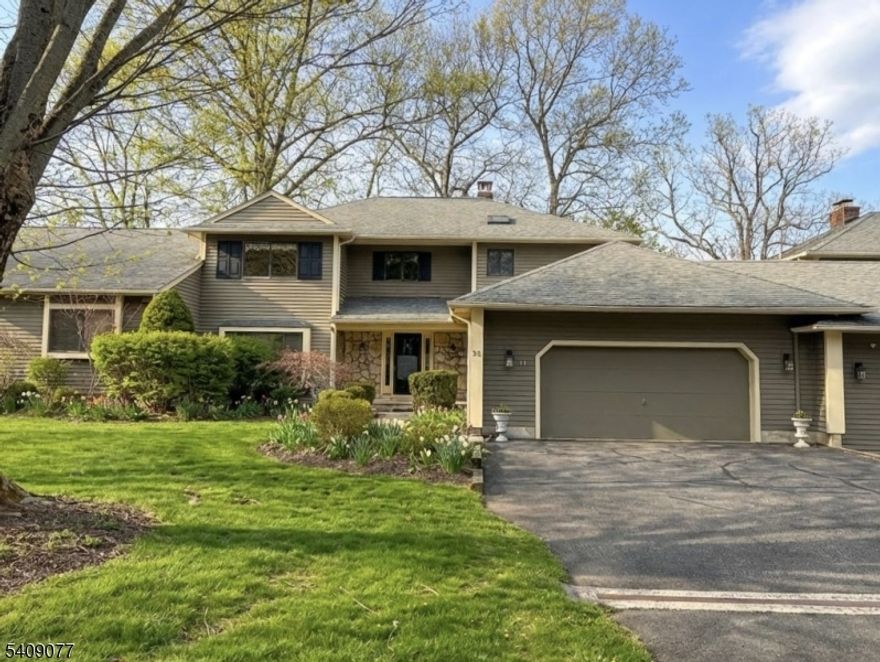 This Deerhaven model is one of the largest and best-located homes in the intimate community of Hunter's Glen with beautiful, landscaped views from every window and close (but not too close!) to the community pool, marrying the convenience of condominium living with the comforts of a traditional home. The generous kitchen, deck, and library spaces are well-configured and comfortable for daily living and also sized to accommodate entertaining needs. The eat-in kitchen features high-end stainless steel appliances, granite countertops, large center island, and large breakfast room with skylights sliding doors to the oversized deck and its private, wooded views. The spacious primary bedroom suite includes a walk-in closet and a large bathroom with a jetted tub and separate shower stall. The 2-story library is suitable as a home office or family room and can be accessed from both the first and second floors. Wood flooring throughout the first and second floors accentuates the traditional styling of the home. The full, finished walkout basement has a large main recreation room with bar area, office, storage room, full bathroom and direct outdoor access adding flexibility for guests and/or hobbies, or work-from-home needs. Convenient to highways, shopping/dining in both historic villages of Oldwick and Clinton, and local recreation areas including Round Valley Reservoir.