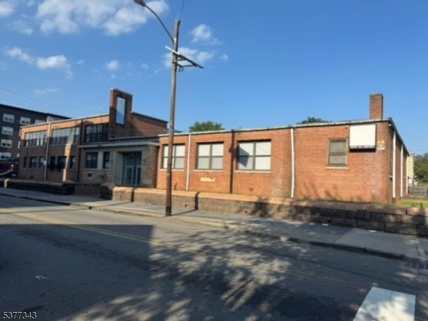 Excellent property in good shape - formerly used as a YWCA, a recreation and learning center. This could be a great property for continued use, and it may also have development possibilities. Property is available immediately. Inside the space are lunch and study areas, a gym, offices, and classrooms. Additionally, there is ample space for parking, a playground, and more. Downstairs, there is a locker room. This building has lots of amenities.