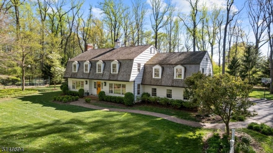 Located on the end of a desirable cul-de-sac in a central Harding Township neighborhood, this six bedroom Colonial combines sophistication and comfortable elegance. The flexible floor plan features well-appointed rooms enhanced by molding details, abundant windows, and gleaming hardwood floors throughout. The first floor includes wonderful entertaining areas such as a den/library with fieldstone fireplace and accent wall, large living room with fireplace and French doors to the patio and banquet-sized dining room. The inviting kitchen is light and bright with professional-grade stainless appliances, large center island and breakfast area with access to the patio. Located off the kitchen, the family room features a gas fireplace flanked by built-ins and a dutch door to the patio. Six bedrooms occupy the second floor including the spacious primary suite with a walk-in closet and a spa-like bath. A large in-law suite with kitchenette and full bath is located off the 2nd floor and can also be accessed by the back staircase for added privacy. More great space is found in the lower level recreation room. Three acres of professionally landscaped property include tall trees, a level green lawn, multiple patio spaces and large storage/work shed. The next owners of this fine Colonial will enjoy neighborhood living in a peaceful country setting just minutes from fine dining, recreational activities, shopping, and schools as well as Midtown Direct trains.
