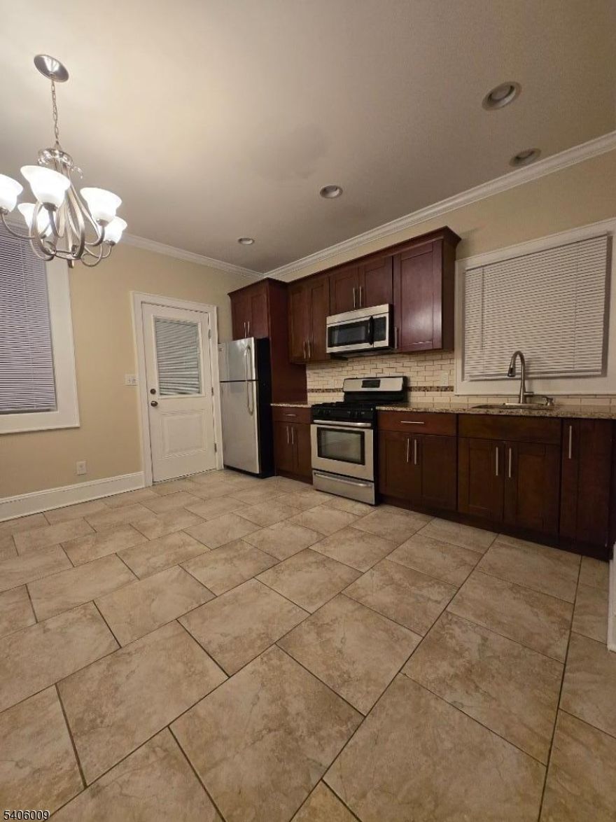 Bright and spacious one-bedroom apartment in excellent condition, filled with natural sunlight and located in the heart of the Ironbound. Just steps from Ferry Street's popular restaurants, shops, and nightlife, with an easy NYC commute. Features include a kitchen with granite countertops and stainless-steel appliances, French doors in the living room and bedroom, and hardwood floors throughout (tile in kitchen and bathroom).