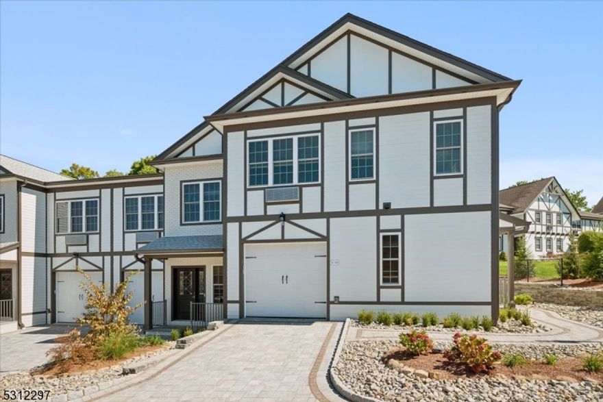 Welcome to The Point at Getaways, where luxury meets convenience. Beautifully appointed New Construction, thoughtfully designed with high-end finishes reminiscent of custom built homes.  This End-Unit 2-story townhome with 1,868 sq ft of space offers 2 bedrooms, 2.5 baths, attached 1-car garage, and a bright and airy layout. Excellent location close to stores, restaurants, top rated schools, and multiple parks, with Routes 46 and 10 nearby for easy commutes. The main level starts with an inviting foyer with a coat closet leading to a spacious living/dining room with rich flooring and tons of natural light. The open kitchen is equipped with sleek white cabinetry topped with stone countertops, and stainless steel appliances for effortless meal prep. A powder room and garage access complete this floor. Upstairs you'll find 2 very generous bedrooms, each with walk-in closets and their own full en-suite bathrooms. The primary bath boasts a walk-in shower while the second bath has a tub, and a convenient laundry closet is in the hall. Residents of The Point at Gateway can enjoy a long list of on-site amenities including a sparkling outdoor pool, clubhouse with lounge and game room, fitness center, playground, BBQ area and more. Pristine move-in ready gem--just unpack your bags and enjoy the luxurious and comfortable lifestyle this unit offers!