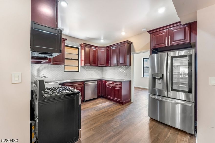 Step into the one of a kind Upper Irvington NJ twin building apartments! A prime location, where 2 and 3-bedroom apartments await. These beautifully completely renovated spaces offer a blend of elegance and comfort. The heart of the home's kitchen space offers the allure of brand-new dark cherry cabinets with soft close features, a modern gas-burning stove, and a touch screen french-door refrigerator w/ice maker. Stay comfortable with the luxury of year-round central AC & forced heat. An elevated bathroom showcasing floor-to-ceiling wall tiles for a lavish touch. Easy commuting, conveniently located just 10 minutes from Newark Penn Station, Newark Airport, Union and Maplewood Train stations, and major highways like Route 78, Route 22, and Garden State Parkway, this property offers easy access to your daily destinations.Not only do you get to call these apartments home, but you also have access to a shared outdoor included amenity space complete with lounge seating and grills for entertaining. It's the perfect place to unwind and relax right at your doorstep.