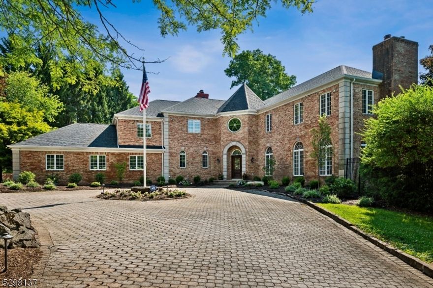 Exquisite French Chateau-Style Colonial in an Idyllic Setting! Set on over 2 acres, this gorgeous estate has everything you dream for a luxurious, comfortable lifestyle in the desirable East side of Mendham Twp. with top-rated schools, close proximity to Morristown's bustling downtown shopping, dining & NYC direct train. A European cedar front door & stately 2-story marble foyer welcome you into this gracious home with many architectural details including Palladian windows, hardwood floors, 4 fireplaces, panoramic views & high ceilings. A spacious living & formal dining room & a butler's pantry leads to a chef's kitchen with NEW appliances, oversized center island & bright breakfast room. Enjoy peaceful outdoor vistas in the family room w/ beamed cathedral ceiling & a stunning fireplace. An office, powder room & laundry room w/access to the attached 3-car garage complete this level. Elegant, curved stairs lead upstairs to a large primary suite with 2 WIC & a spa-like bath + jetted tub. A bedroom & playroom share a full Jack-and-Jill bath & a separate wing accessible via a second stairwell has a bedroom suite that's ideal for guests, along with another bedroom & full hall bath. The finished walk-out lower level offers a huge rec-room for informal entertaining, exercise area & a bathroom. Effortless warm-weather entertaining awaits with a wrap-around deck, heated in-ground pool + hot tub, paver patio with outdoor kitchen & sprawling lawn fully fenced for security and privacy.
