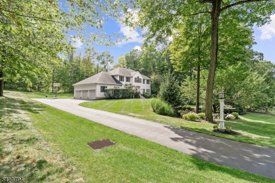 Tucked away on a quiet cul-de-sac street in Sparta Mountain Reserve, this gracious home offers space, comfort, and a peaceful setting on over an acre of land. The backyard is designed for everyday enjoyment, featuring a large flat lawn, wooded surroundings, an in-ground pool, and an expansive patio perfect for relaxing or entertaining. Inside, you'll find over 3,900 SF of finished living space w/an open floor plan offering a great flow for parties and everyday living. The versatile 1st flr home office features a wall of B/I shelving. Natural light fills the home, and the breakfast area provides a great spot to enjoy views and access to pool and backyard. The 2nd floor features new LVP flooring and includes spacious bedrooms with ample closet space. The primary suite has 2 walk-in closets (each with BI organizer) and a spa-like bath w/double vanity, a soaking tub and an oversized shower. The finished LL adds flexible space for recreation, fitness, work, +/or media use, plus a workshop and a powder room + multiple storage areas. Additional highlights inc. a 2.5-car garage with 3 overhead doors, a laundry/mud room with backyard access, and updated mechanicals including a newer furnace w/heat pump + hot water heater. Natural gas installed at street for your future possible conversion. Pre-sale septic inspection + repairs completed w/county COC in place. Just mins to shopping, dining, major commuting routes plus ez access to outdoor recreation. Exceptional maintenance history too!