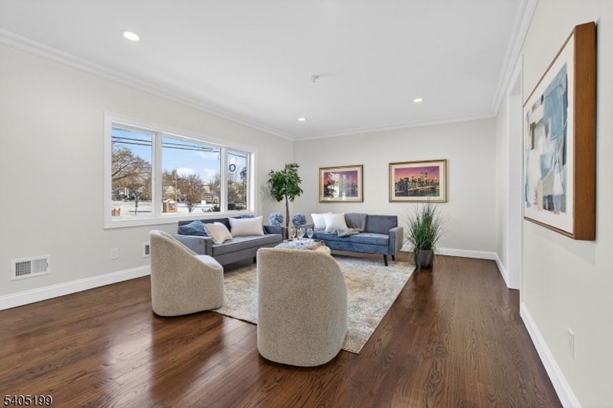 Welcome to this stunning Fair Lawn side-hall Colonial completely gutted, expanded, and rebuilt to feel like brand-new construction. This bright and sunny home is filled with natural light, featuring an open layout, modern finishes, and thoughtfully designed spaces that make everyday living feel relaxed and comfortable.This home offers 5 spacious bedrooms and 3.1 beautifully finished bathrooms, including a serene primary suite with generous closet space. Upstairs laundry adds the convenience today's buyers love, while spacious closets throughout provide incredible storage.Enjoy year-round comfort with 2-zone heating and central air, plus peace of mind upgrades including a full sprinkler system. The finished basement offers valuable additional living space perfect for a gym, office or guest suite.Step outside to a fenced-in yard, ideal for entertaining. Additional highlights include an attached garage and a prime location close to public transportation, shopping, and houses of worship.Just imagine making this gorgeous home your own where modern style meets smart functionality, in one of Fair Lawn's most desirable neighborhoods. Simply move in and enjoy.