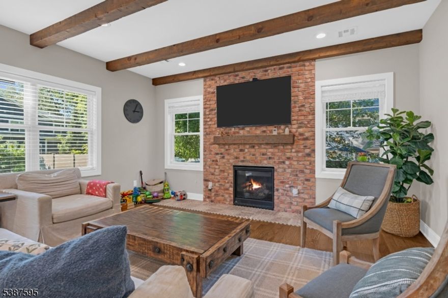 Built in 2020, this Colonial offers approximately 4,000 sq ft of living space with 4 bedrooms and 3.5 baths. The home features high ceilings, recessed lighting, hardwood floors, and an open layout connecting the kitchen, dining area, and family room with fireplace. The kitchen is equipped with stainless steel appliances, quartz countertops, and ample cabinetry.The second floor includes a primary suite with walk-in closet and full bath, three additional bedrooms, and a laundry room.The finished basement provides flexible living space, and a separate home office adds convenience. Additional features include a two-car garage, attic storage, landscaped yard with patio and irrigation system, smart home technology, and a whole-house generator.Located on a quiet street with close access to downtown Summit, parks, schools, and NJ Transit.