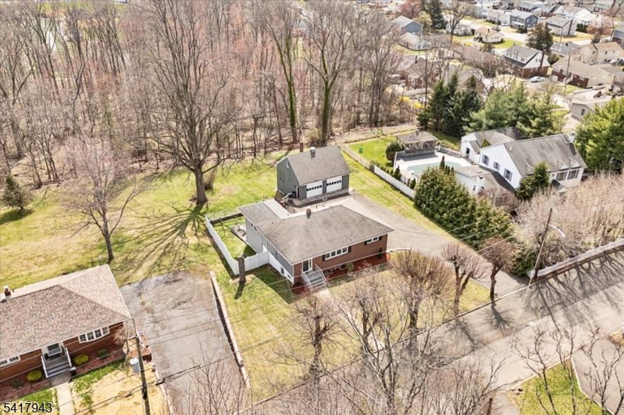 A rare find in Totowa! This custom brick front ranch with in-law suite potential is nestled on a quiet street that backs up to the PAL. Situated on a .67 acre lot,  the main level offers 3 Bedrooms, full bath, updated eat-in kitchen with granite counters, vinyl floors and tile back splash, Dining Room, LR , Walk-up attic for storage, Family room addition with gas fireplace and separate heat w/entry to deck. The lower level with a separate ground floor entrance which walks out to the patio features a summer kitchen, dining room, 4th bedroom with huge walk in closet, full bath, living room/family room and a possible 5th BR. Hardwood floors, recessed lighting, central air, replacement windows, A mechanic's dream w/ a 2 Car heated garage & loft storage, huge driveway with parking for up to 20 cars! Oversized lot with vinyl privacy fence, underground sprinkler system, newer water heater (2022). All appliances included. Located on a very quiet street in town that backs up to the Totowa PAL.  This is the one you have been waiting for!  Home to be Sold in "As Is" Condition. Inspections limited to major structural, environmental and wood boring insects.