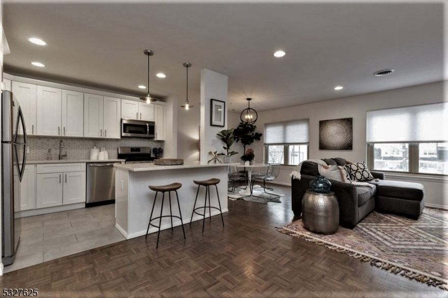 An unbeatable VALUE -hot/ cold WATER + HEAT + GAS +PARKING are all INCLUDED in the rental PRICE. So NO additional surprise bills, just electric. This private CONDO offers Central AC, Huge OPEN layout w/ sunken LR + DR+ Kitchen fabulously remodeled w/QUARTZ counters + center ISLAND w/seating & SS appliances. Master BR w/ REMODELED en-suite BATH, huge double CLOSETS, LR has perfect corner for home OFFICE desk /space. GARAGE avail for a fee. LOCATION, LOCATION ! Very near DOWNTOWN & NYC direct Bus, WHOLE Foods, ART Museum, WELLMONT Theater - LIVE concerts, Montclair film festival/CINEMA. BOUTIQUE stores & Boutique Ethnic, vegan, organic... RESTAURANTS w/ BYOB, yoga & SPA/ beauty centers. DIRECT- NYC train few blocks away.