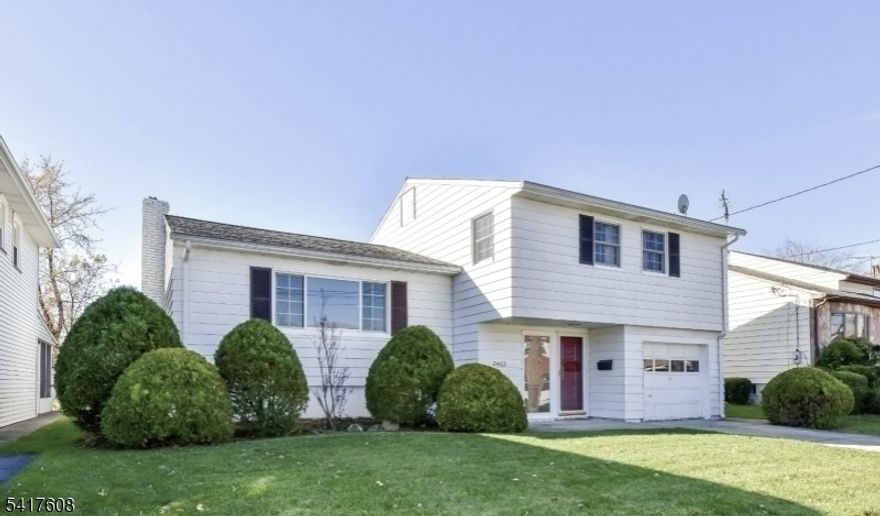 This beautiful Split -Level home is located close to Battle Hill Elementary School. The Home offers 3 bedrooms on the 2nd floor, 1 possible 4th bedroom/multipurpose room in basement, two full bathrooms and two half bathrooms. Wood floors on the first and second floor are in great condition. Slate tiles are in the Foyer and family Room. A powder room and access to the garage are located near the family room. Newly installed Anderson Windows is throughout the home and carry a transferable 30-year warranty. A new countertop stove is provided. The primary bedroom has access to the attic, a walk-in closet AND reach-in closet and a half bath en-suite. Multipurpose basement with full bathroom and possible 4th bedroom. Very well maintained and spacious backyard. No oil tank. Property is being sold strictly as is. Sellers will not entertain credits. Buyer is responsible for city cert and c/o. Owner occupied