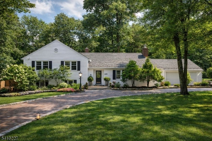 Move right into this beautifully renovated 4-bedroom, 3-bath custom home set on an expansive, park-like property in the sought-after Deerfield section of Short Hills. A circular driveway and mature landscaping create inviting curb appeal, while sun-filled interiors and an open, airy layout offer exceptional flow for everyday living and entertaining.The oversized living room features gleaming hardwood floors and abundant natural light. The updated chef?s kitchen showcases stone countertops, premium Thermador, Sub-Zero, and Bosch appliances, a spacious breakfast area, and seamless indoor?outdoor access. A striking full-glass sunroom overlooks the lush backyard, complete with a large stone patio and pergola, ideal for year-round enjoyment. Upstairs, the primary suite offers a spa-like bath, joined by three generously sized bedrooms, a newly finished hall bath, and ample storage. The bright lower level with large windows provides a flexible living space with a family room or possible 5th bedroom, a home office, and a full bath. Recent updates include furnace, central air, water heater, garage door, and cedar fencing for added peace of mind. Enjoy one of the area?s most inviting backyards with sweeping lawn, gazebo, and room to relax or entertain, all conveniently located near parks, shopping, dining, and direct NYC transit.