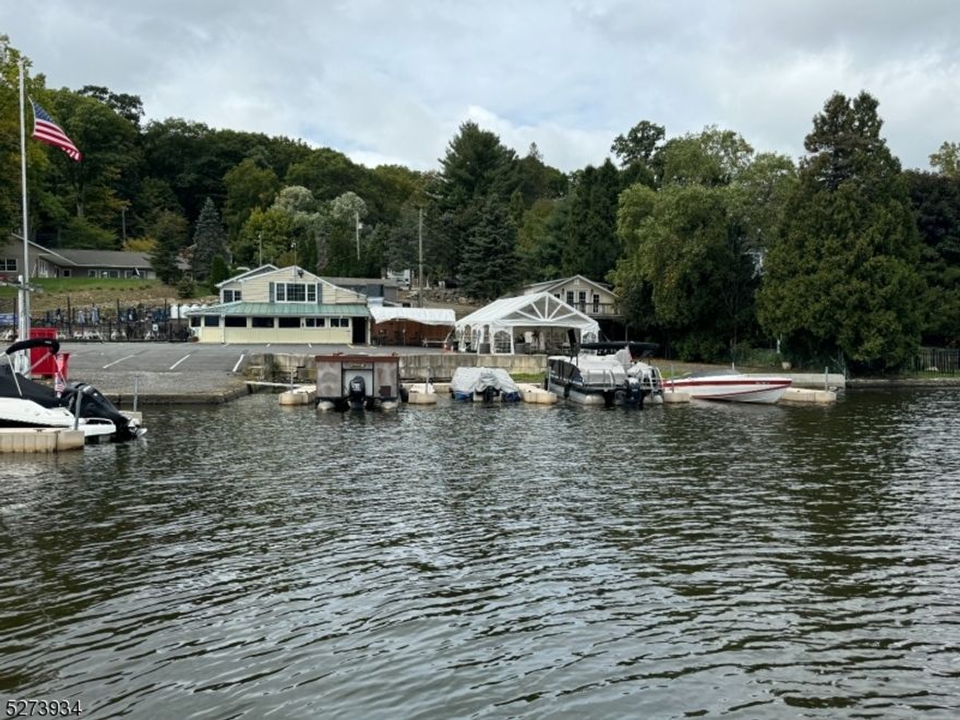Excellent opportunity to own this thriving year-round lakefront restaurant/ bar! There are approx 30 slips for customer docking and 10 rental dock spaces generating $22,500/ year along with 6 studio apartments generating appx $86,000/ year with their own parking, septic, utilities, and lake views. The main bar seats up to 50 with additional seating in the restaurant and additional outdoor seating. The restaurant is open 6 days a week serving lunch and dinner, with breakfast being served on the weekends. There is a second floor great for office or additional storage. Property includes a full kitchen , appliances, and stage for bands. + Sale will include 22 Mason St Lot 7 Block 95.  LIQUOR LICENSE IS INCLUDED IN THE SALE!