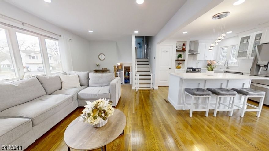 Renovated 1,659 sqft. Split Level home w/ 4 Levels. Ground floor has a spacious entry foyer w/ custom coat built-in, garage access, den w/ bathroom & sliding doors to patio.  The main level features an open-concept layout w/ living rm, dining rm, & kitchen w/ center island. The kitchen includes, white shaker cabinets, SS appliances, & a pantry closet. The dining area has sliding doors leading to a deck w/ awning, overlooking large fenced backyard. The 2nd flr offers 3 bedrms & lg bathroom, along w/ generous closets.  The finished basement includes a utility, laundry, family & office rooms.  Lots of natural light, central air, forced hot air, hardwood floors, move in ready.  Property is 75x120 (Deep & Wide Lot - Fenced in) Located in Edison near shopping, dining, parks, & major transportation routes, including RT 1, 27, 287, NJ Turnpike, & GSParkway. Nearby is Amazon Hub & Edison Train Station / NJ Transit. Located in the Clara Barton section of Edison, this property is served by the Edison Township School District, which is ranked among one of the higher-performing public school districts in New Jersey and offers a wide range of academic and extracurricular programs.