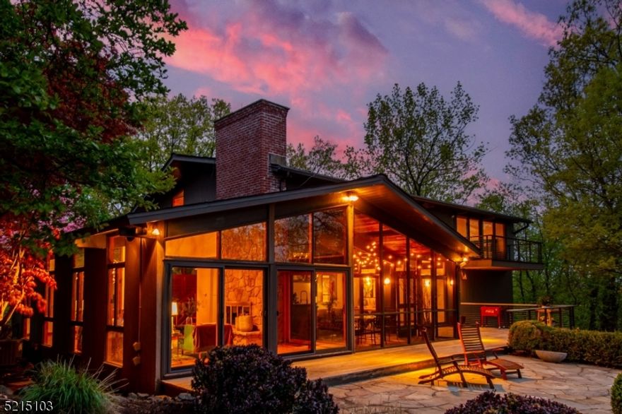 Are we really in Upper Montclair, just 1/2 mile to shops, train, restaurants? Country living meets city life in this unique & dramatic contemporary, which sits on a 1.4 acre wooded lot tucked away in a secluded enclave of 7 homes that the residents refer to as 'the hill.' During the seller's Ownership, this special home has been completely renovated while creating an open floor plan. Kitchen features 10' quartz island w/ seating for 5, Thermador & Wolf appliances, stone floor, separate eating area w/ 2 pantries. Impressive stone fireplace in the great room is a focal point in this post & beam home w/ vaulted & beamed wood plank ceilings. Expanded stone patio & deck are accessed through kitchen, living room & screened porch, w/ many floor to ceiling windows to maximize light, views and nature. First floor also offers convenient guest bedroom (or office) plus full bath w/ stall shower. Primary bedroom includes WI closet & wall of closets, updated bath w/ WI shower, separate soaking tub, double sinks plus sliders to private deck overlooking the woods & the city. Second flr also offers 3 add'l bedrms, hall bath & laundry room. Ground level rec room has bamboo flooring & leads to attached 2 car garage w/ a 3rd bay for add'l storage. 3 zone heating/cooling. Roof, ac, furnace, hwh are all less than 5 yrs old. Chimney just rebuilt last week. Very private lot with panoramic NYC views from first & second floors. One of a kind house and property! USE 15 Bradford Way Cedar Grove for GPS.