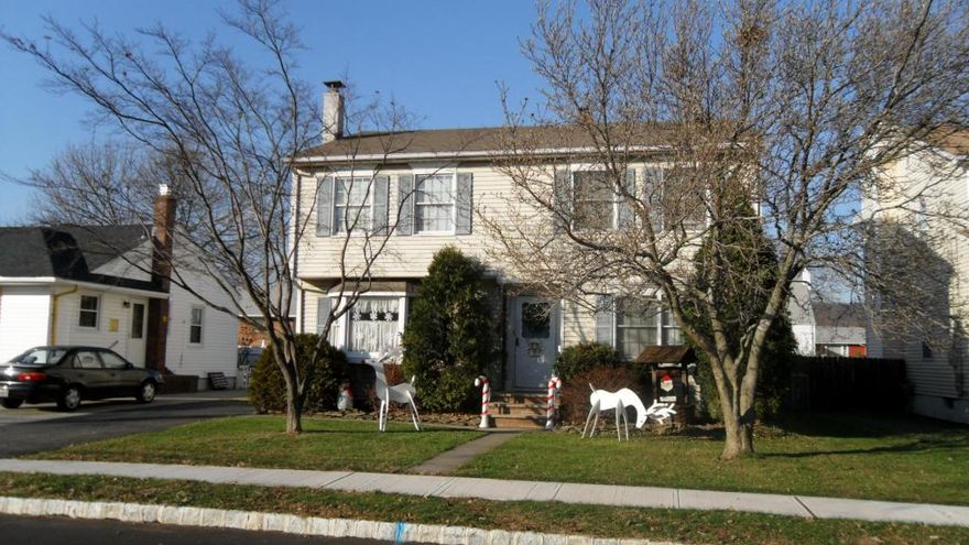 One of a kind 4-bedroom, 3.5 bath colonial with 2-car built-in garage & driveway. Approx. 3,500 sq ft of living space in this modern home in the Manor Section of Kearny! The first floor features a large living room, formal dining room, half bathroom, kitchen with island & granite tops, a movie theater room with full bar, professional size pool table, & sliding door to balcony overlooking 50 x 152' lot. The 2nd floor features 4 bedrooms and 2 bathrooms, including a king-size bedroom with a cathedral ceiling, balcony, and skylight, as well as a walk-in closet and a private bathroom with a jetted tub, and shower stall. Pull down attic, luxury sauna, and washer dryer. Finished basement with kitchen & full bathroom with a walk out to rear yard. 2 Separate gas HVAC heat & air conditioning systems, natural wood trim and hardwood floors throughout. The rear yard boasts a covered patio, room for an above-ground pool, basketball court & yard. Lots of closet and storage space. A one of a kind well kept spacious home. Just 2 blocks to the NYC Bus.