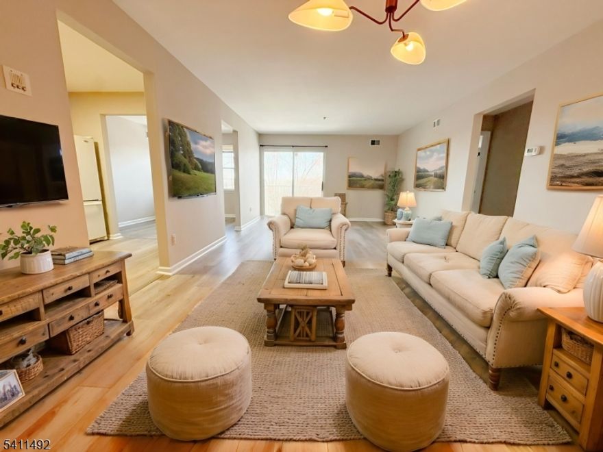 This spacious, move-in ready Timberline unit blends comfort, convenience, and low-maintenance living in a bright, welcoming setting. A large private balcony with spectacular views creates a peaceful outdoor retreat perfect for morning coffee or relaxing evening sunsets. Inside, brand-new vinyl flooring and fresh paint provide a clean, modern feel, while the two-year-old furnace and AC offer added efficiency and peace of mind.Sunlight fills the family room and formal dining area, creating a warm atmosphere ideal for both everyday living and effortless entertaining. The primary suite serves as a private retreat, featuring a walk-in closet for easy organization and a beautifully updated bath designed for relaxation. A well-appointed second bedroom and full guest bath offer flexible space for visitors, a home office, or both.Enjoy the convenience of an in-unit washer and dryer, dedicated ground-floor storage for seasonal items, ample resident and guest parking, and a secure intercom system for added peace of mind.Resort-style community amenities include a pool, tennis courts, playground, clubhouse with billiards, fitness room, kitchen facilities, and scenic walking paths. Ideally located just minutes from Route 80 and only one mile to the train station, this home offers easy commuting and everyday accessibility within a vibrant, well-maintained community ready for immediate occupancy.